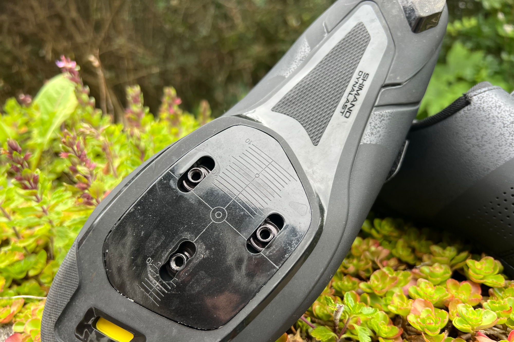Sole of the Shimano SH-RC102 road cycling shoe revealing the crosshair measurement reference points