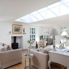 living room with glass roof and sofa with cushions
