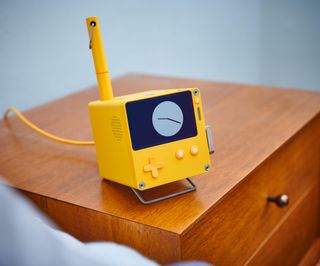 Playdate pocket console by Panic with its optional Stereo Dock