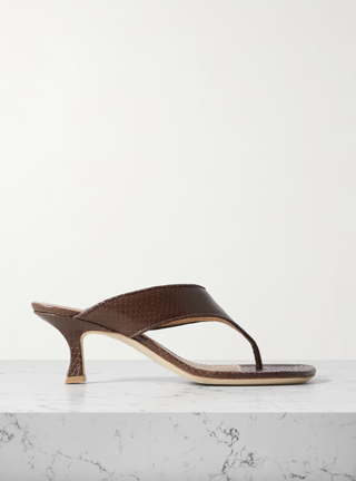 staud sandals in front of a plain backdrop