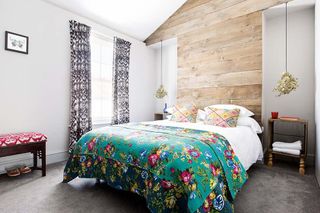 master bedroom with colourful bedspread in a brighton townhouse