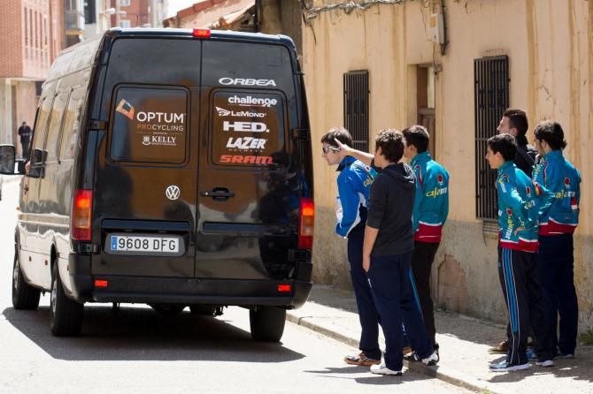 The reason sponsorship exists - eager young fans appraise the logos on the back of the team van
