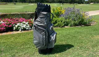 Big Max Dri Lite Silencio 2 Golf Cart Bag in front of flowers