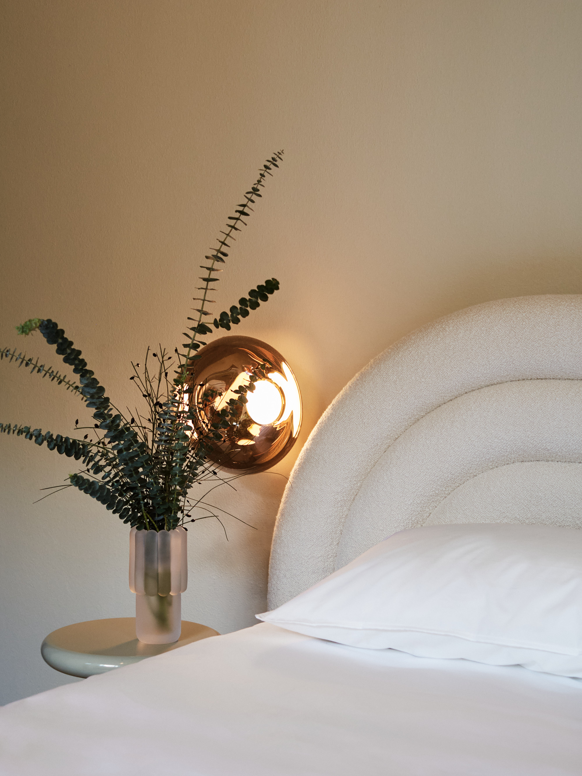 Inside Mua Mua Hotel designed by Tom Dixon for Milan Design Week 2026, featuring Tom Dixon x Vispring bed collaboration