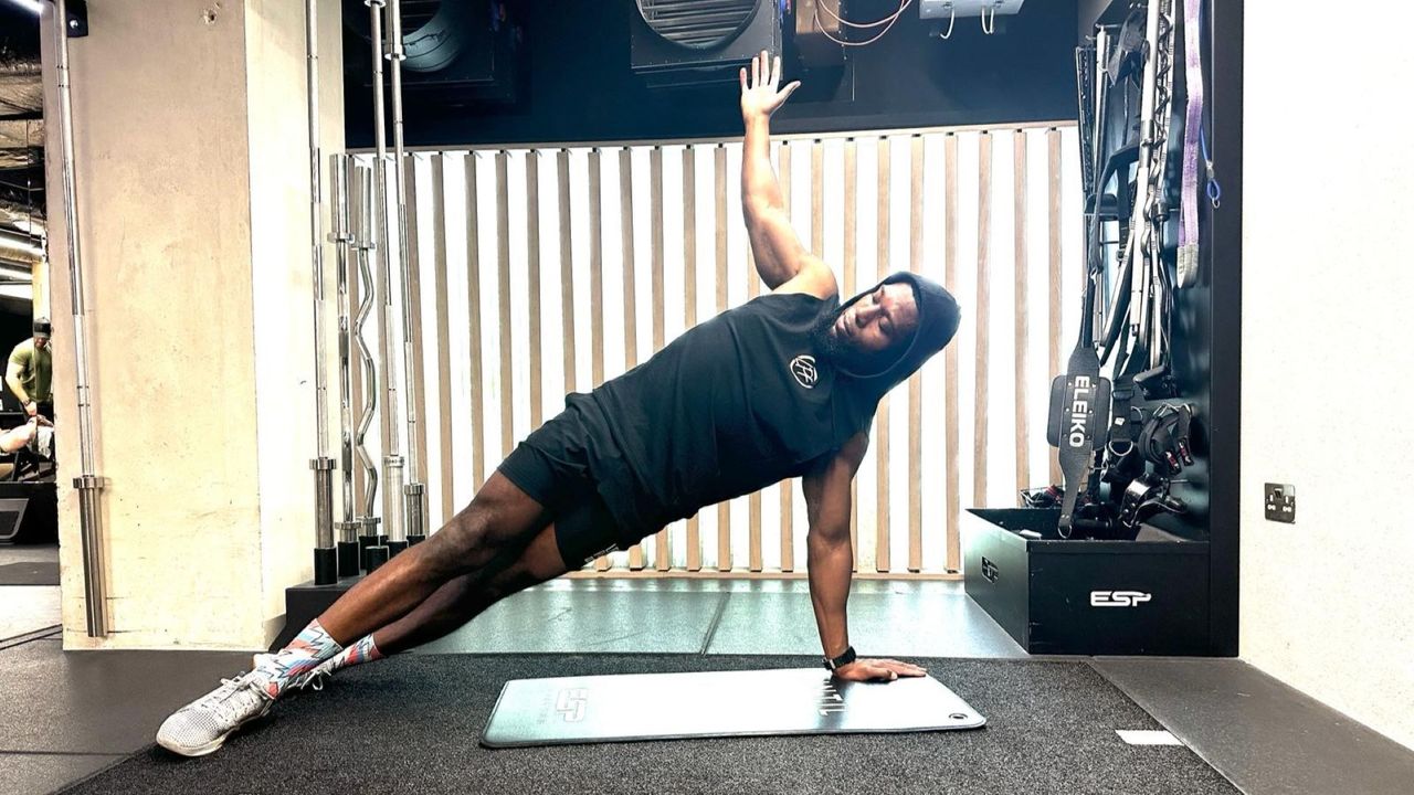 Lewis Paris performs side plank