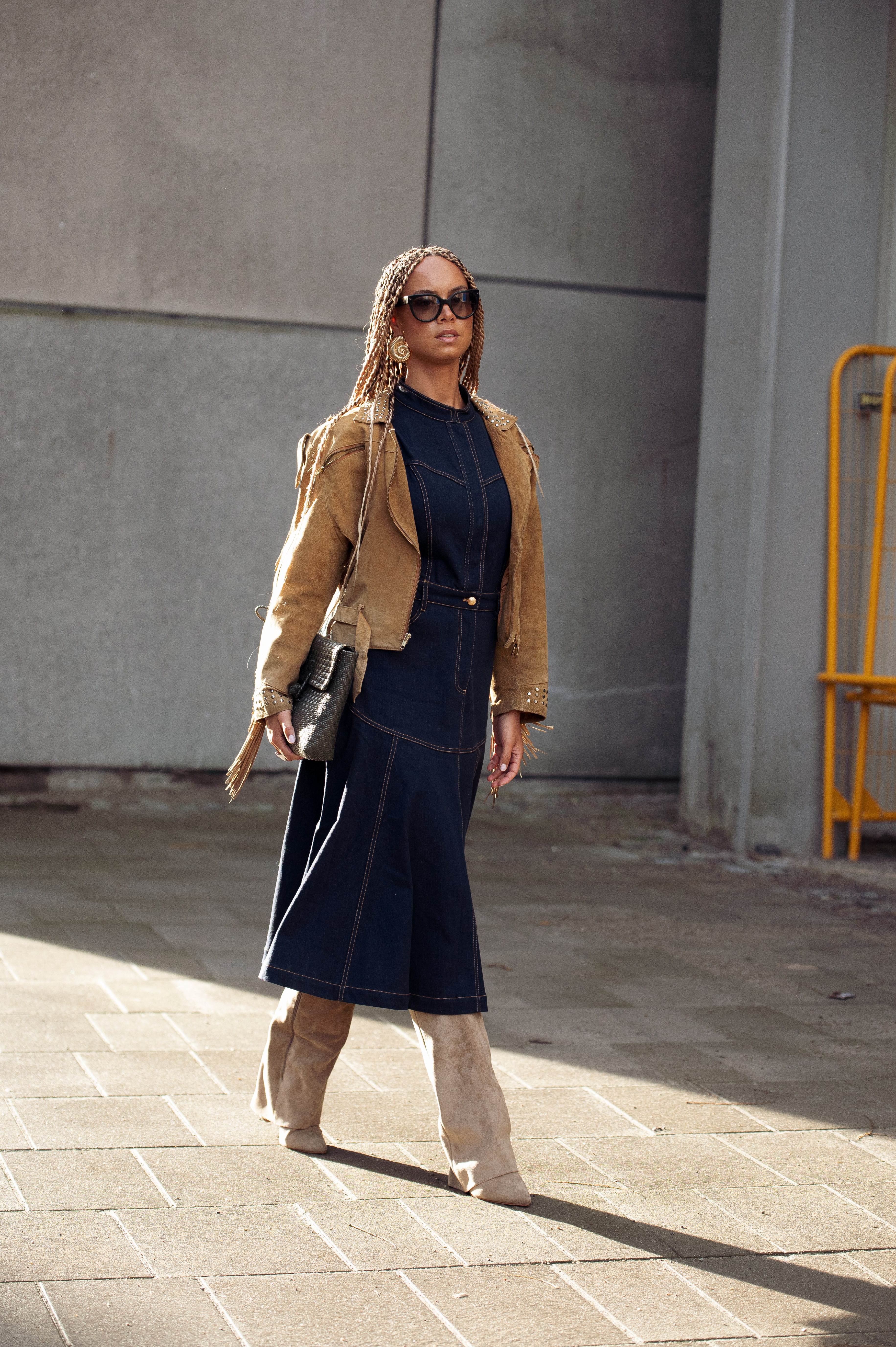 Woman in dark-wash denim dress