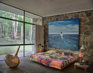 The Noyes House bedroom features more pieces by Gaetano Pesce as well as a bedspread by Megumi Arai and art by Antonio Obá on the wall