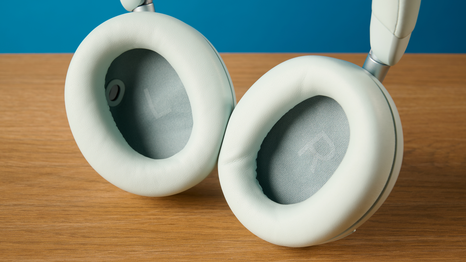 the soundcore space 2 headphones in white photographed against a blue tom's guide background