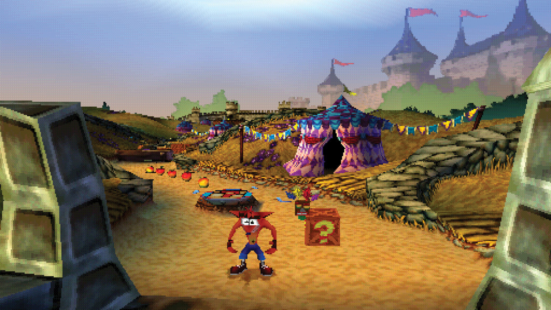 Crash Bandicoot standing next to a box with a question mark on, with a fairground in the background in Crash Bandicoot: Warped