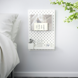 Use the Skadis pegboard to replace your nightstand