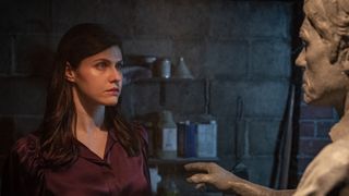 Rowan (Alexandra Daddario) and Statue Cortland (Harry Hamlin) in Mayfair Witches season 2