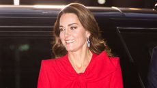 Kate Middleton's red dress wows as she attends the "Together at Christmas" community carol service on December 08, 2021 i