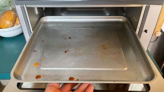 Detritus on the Cuisinart Air Fryer Toaster Oven's baking pan