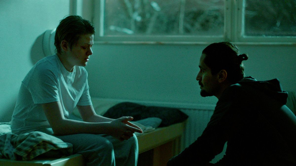 Dogge (Olle Strand) talking to Josef (Zardasht Rad) in Deliver Me episode 2.