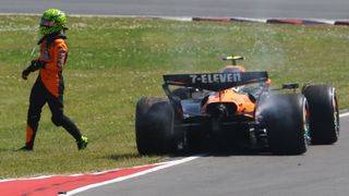 Lando Norris steps outside his McLaren after crashing in the Canadian GP