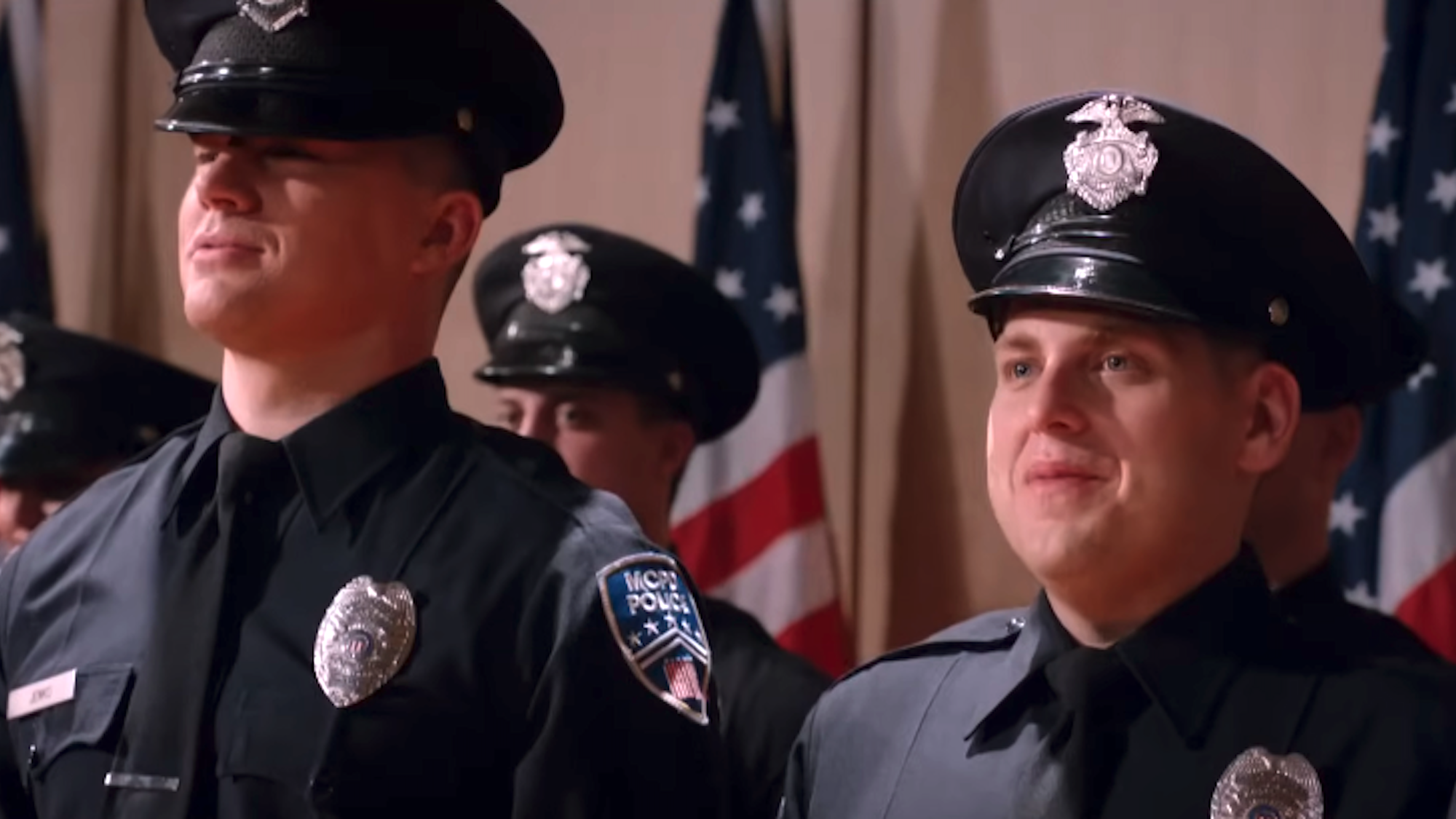 Channing Tatum and Jonah Hill in cop uniforms in 21 Jump Street