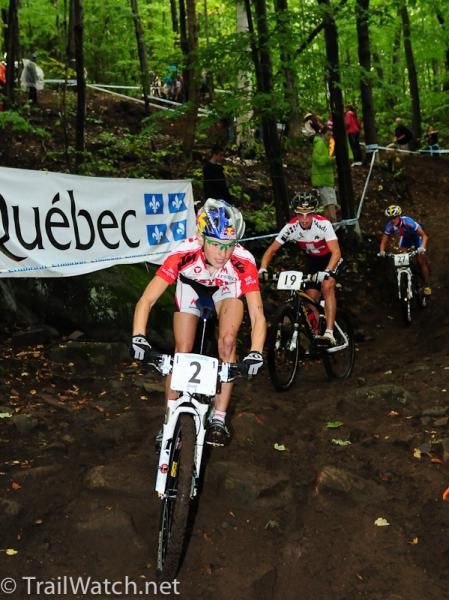 Elisabeth Osl (Austria) leads a long train of riders down some switchbacks