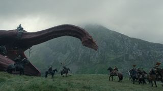 Caraxes (ridden by Daemon) stands over mounted troops in "House of the Dragon" season 2 episode 5