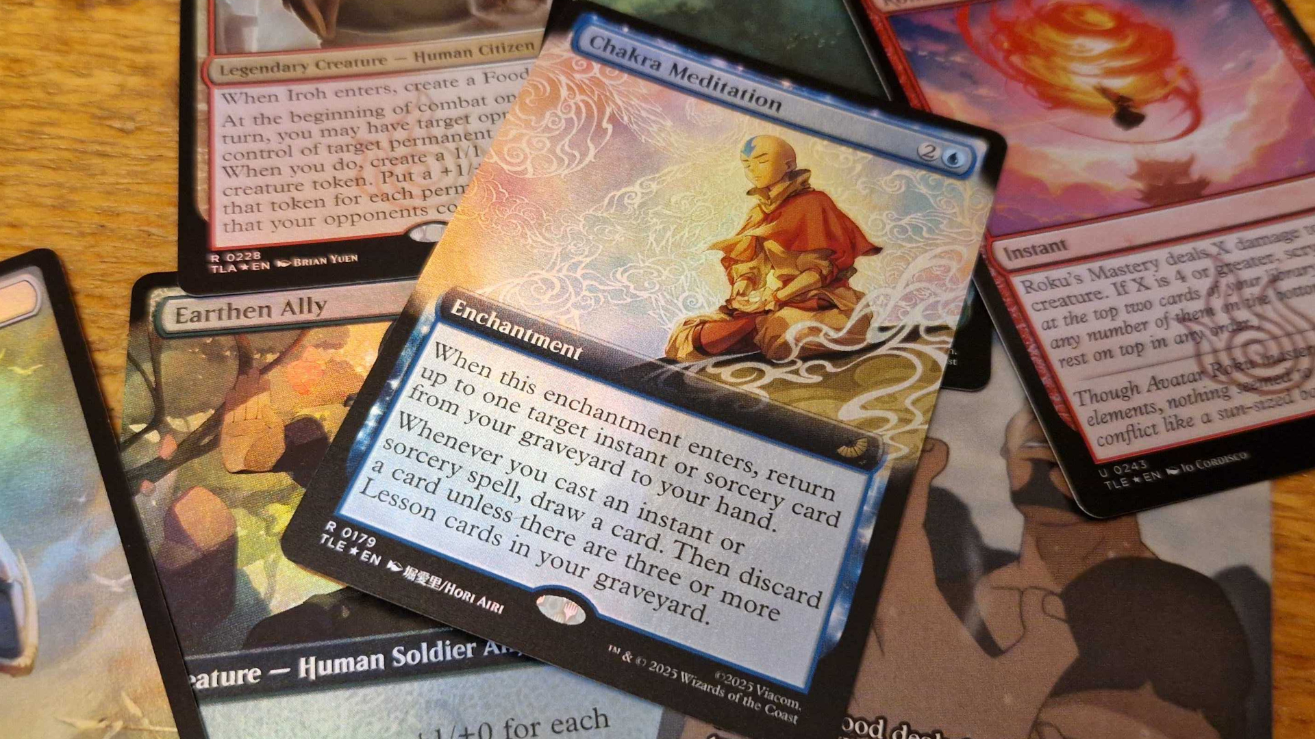 MTG Avatar: The Last Airbender cards laid out on a wooden surface