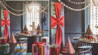 Dark blue dining room dressed for Christmas with a red bow on the door to show fun Christmas decorating ideas