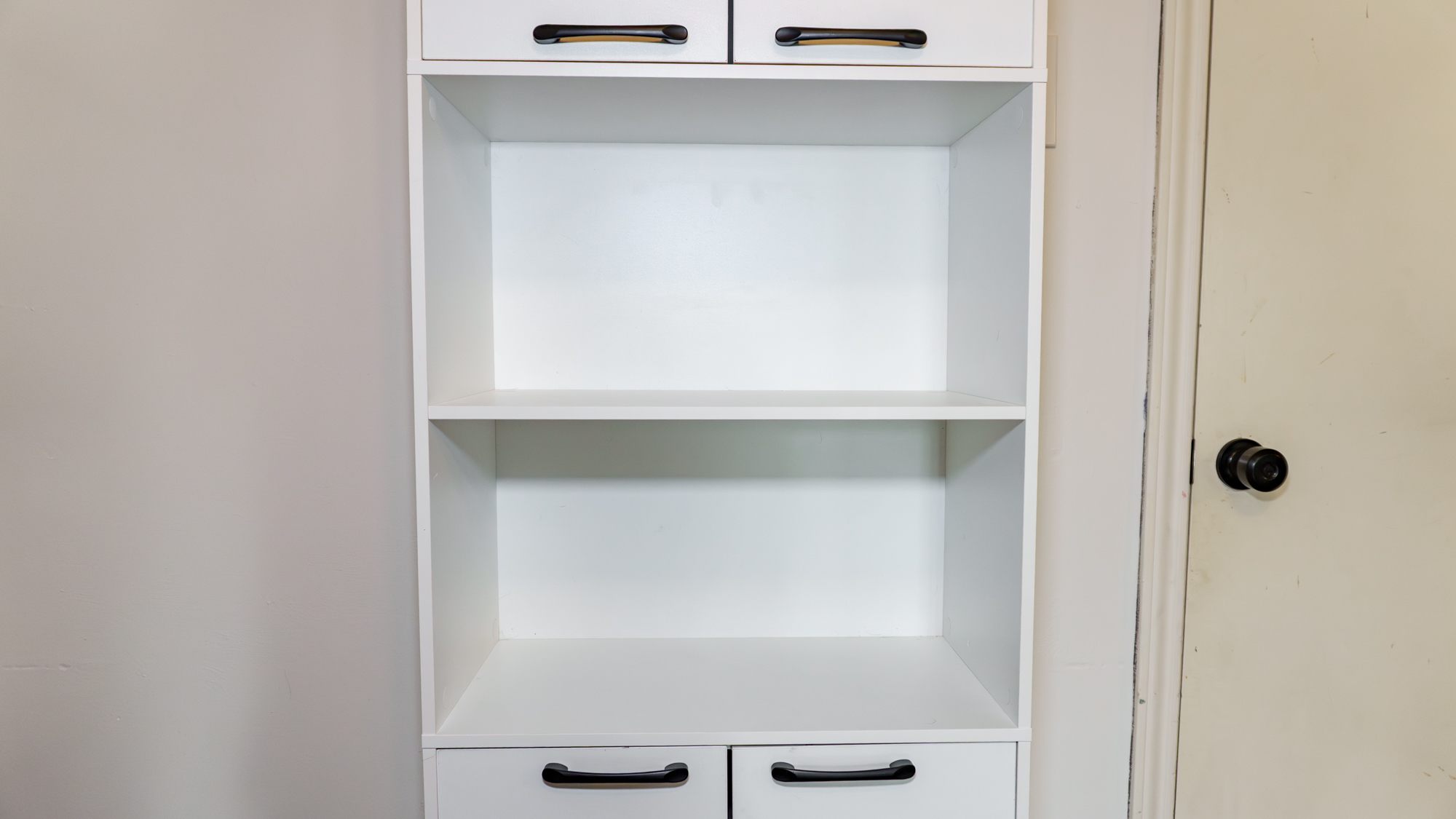 A picture showing an unmodified kitchen pantry cabinet