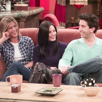 Jennifer Aniston, Courteney Cox, David Schwimmer, and Lisa Kudrow on the set of the sitcom 'Friends'