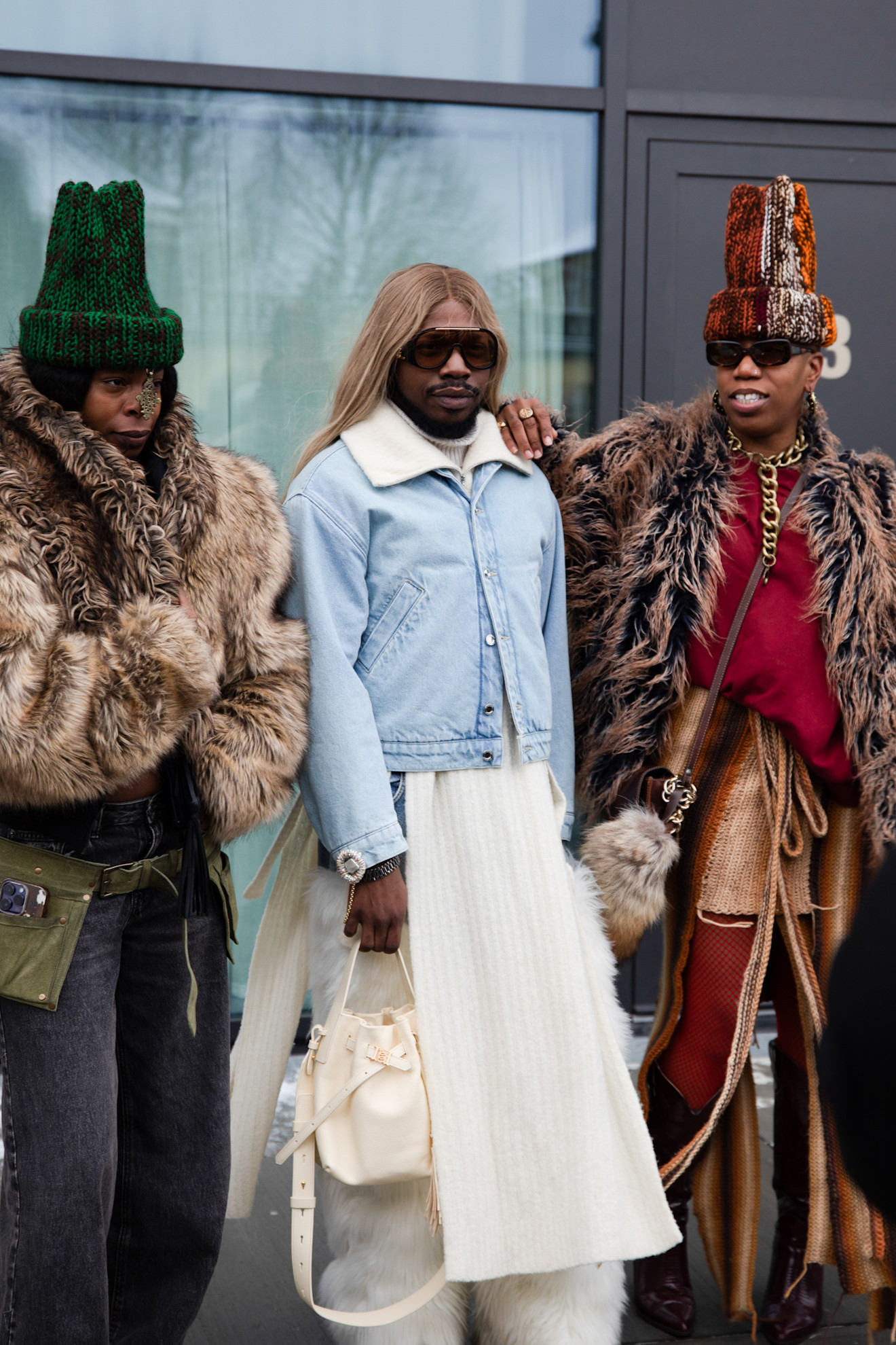 guests at copenhagen fashion week wearing fur coats and hats