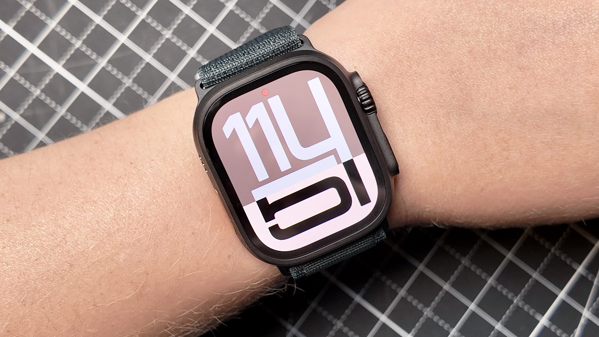 Close-up of the Apple Watch Ultra 2 in jet black on a user's wrist