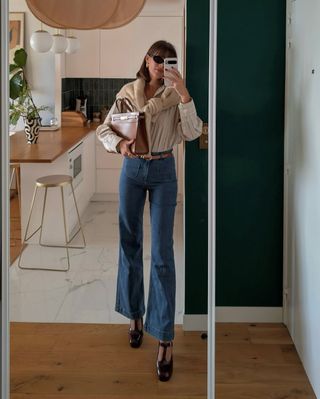 @juliesfi wearing wide-leg jeans, shirt and jumper