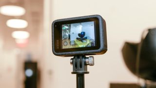 GoPro Hero12 Black mounted onto selfie stick.