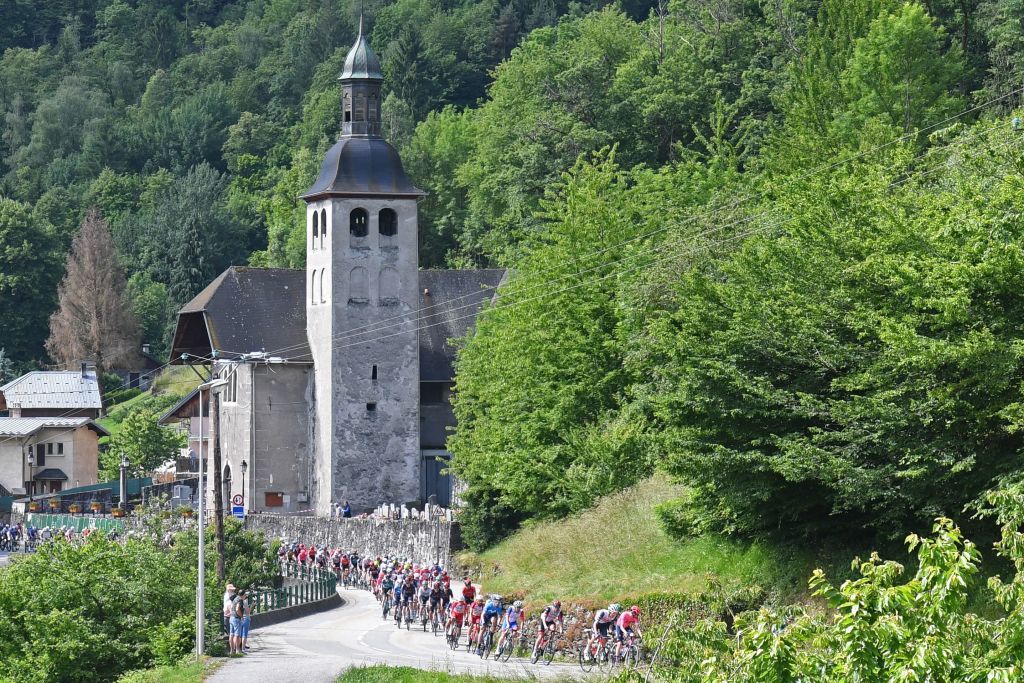 The pack rides during the eighth stage of the 73rd edition of the Criterium du Dauphine cycling race a 147km between La LechereLesBains and Les Gets on June 6 2021 Photo by Alain JOCARD AFP Photo by ALAIN JOCARDAFP via Getty Images