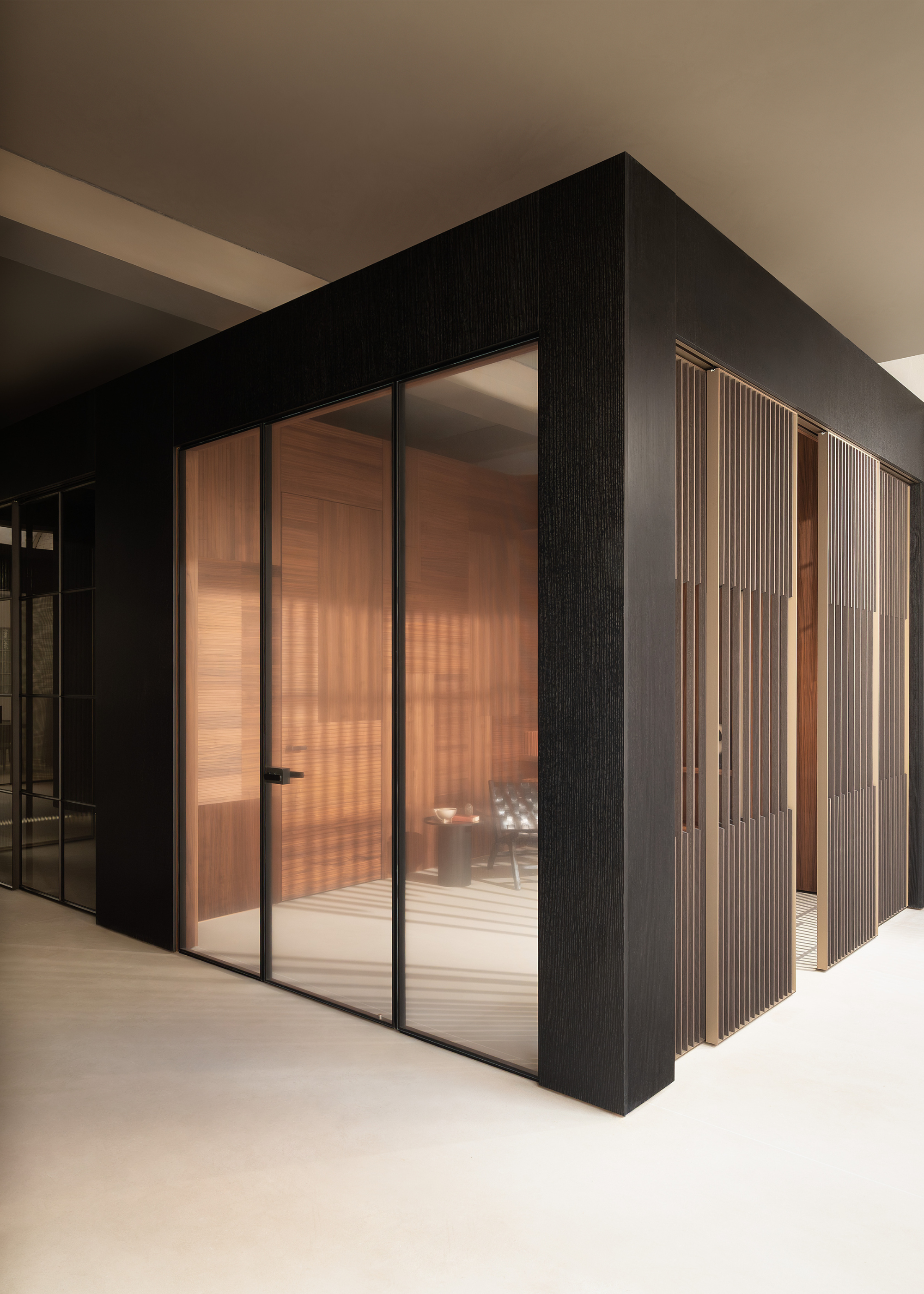A room with glass doors and sliding slatted doors on either side