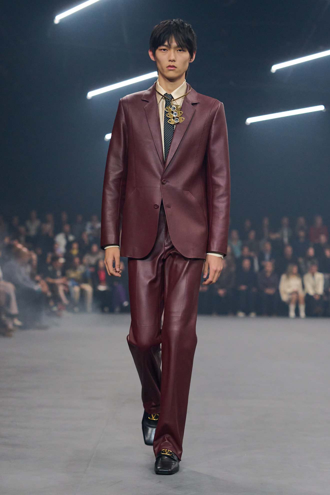 Valentino model wearing a leather blazer in the Spring 2026 show