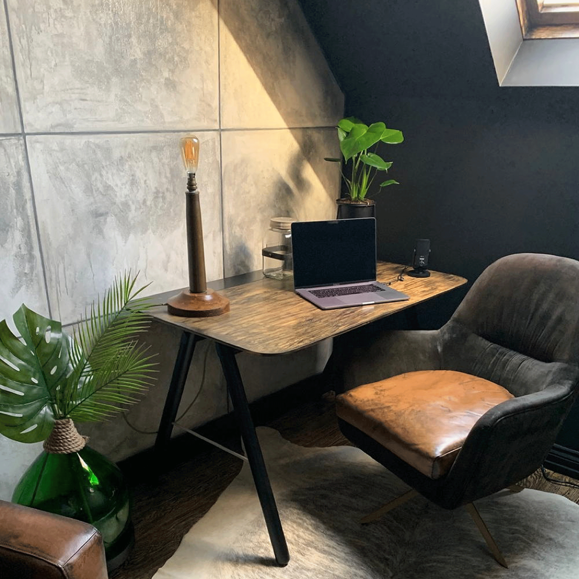 Grey home office with wooden desk and leather chair
