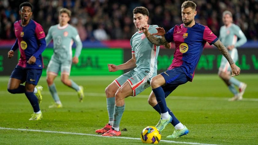 Julian Alvarez of Atletico Madrid, Inigo Martinez of FC Barcelona during the LaLiga EA Sports match between FC Barcelona v Atletico Madrid at the Lluis Companys Olympic Stadium on December 21, 2024 in Barcelona Spain