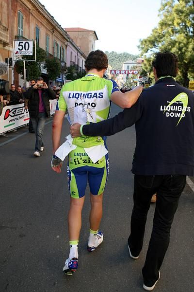 Fabio Sabatini (Liquigas-Doimo) is assisted by team staff following his crash.