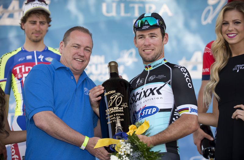 Peter Sagan looks on enviously at the large bottle of wine that Mark Cavendish won himself