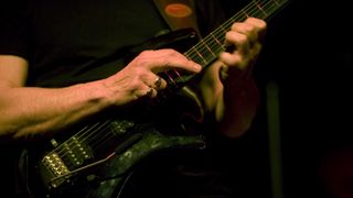 Harvey Mandel performs two-handed tapping onstage with Canned Heat at Queens Hall on July 31, 2010 in Edinburgh, Scotland