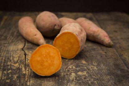 How to grow sweet potatoes orange sweet potato on table