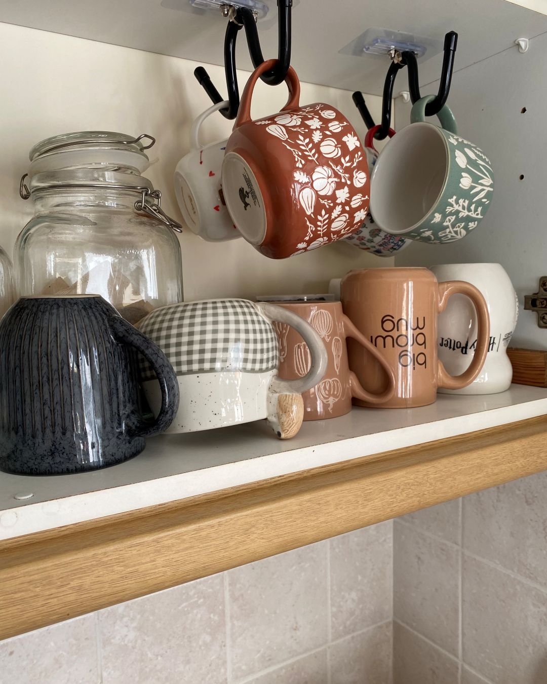 Cupboard with mugs placed upside down