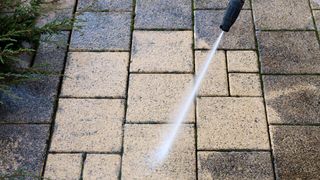 Power washer on concrete