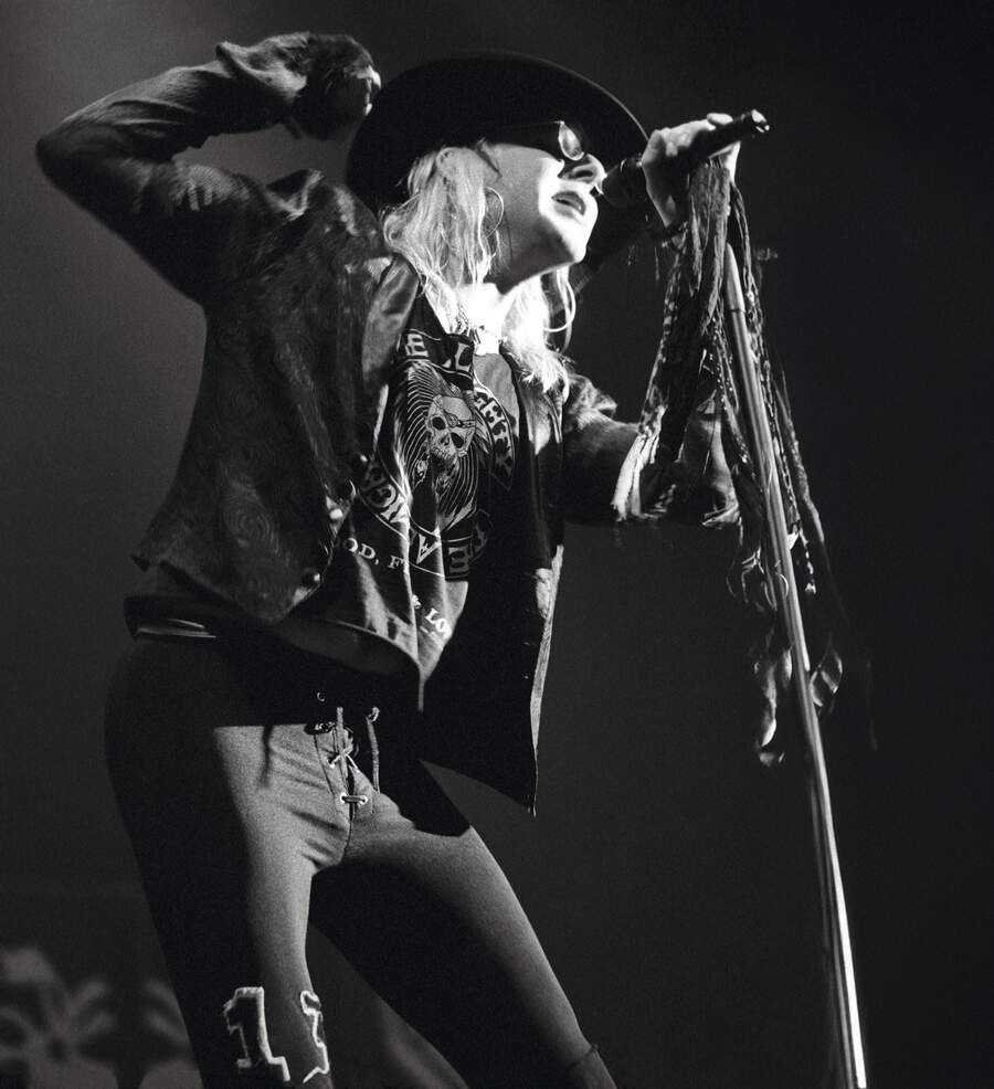 Taime Downe of Faster Pussycat performing on stage, London, United Kingdom, 1989