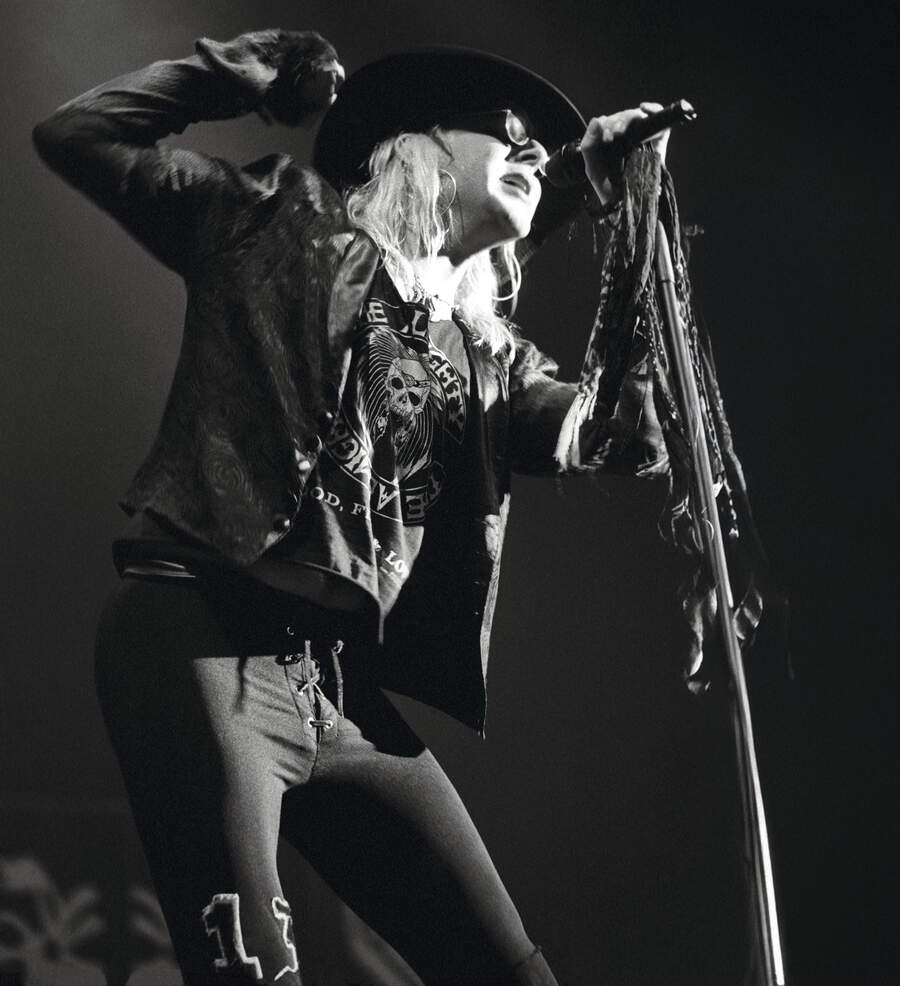 Taime Downe of Faster Pussycat performing on stage, London, United Kingdom, 1989