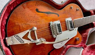 A vintage Gretsch Tennessean signed by all four members of the Monkees