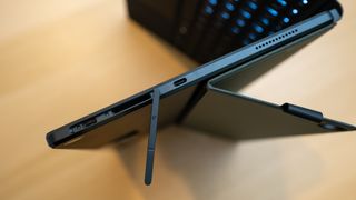 Close-up of Asus ProArt PZ13tablet hinge on a wooden table