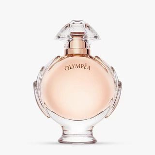 A round glass Paco Rabanne Olympea Eau de Parfum bottle is one of the best vanilla perfumes.