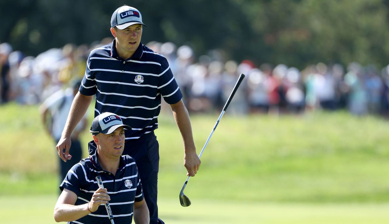 Justin Thomas and Jordan Spieth line up a putt