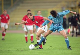 David Platt of England and Zanotti of San Marino during a World Cup qualifier match between San Marino and England, 17th November 1993. England won 1-7.