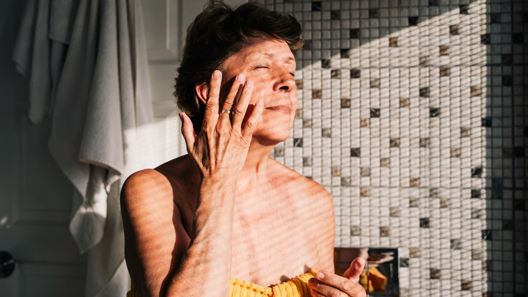 A senior woman in a towel