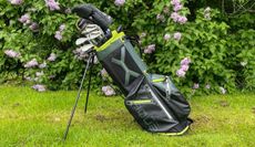 The Big Max Aqua Eight G Stand Bag standing up with clubs in it